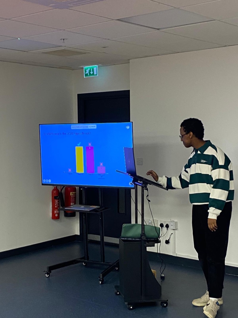 A student presents at an Access to Medicine workshop