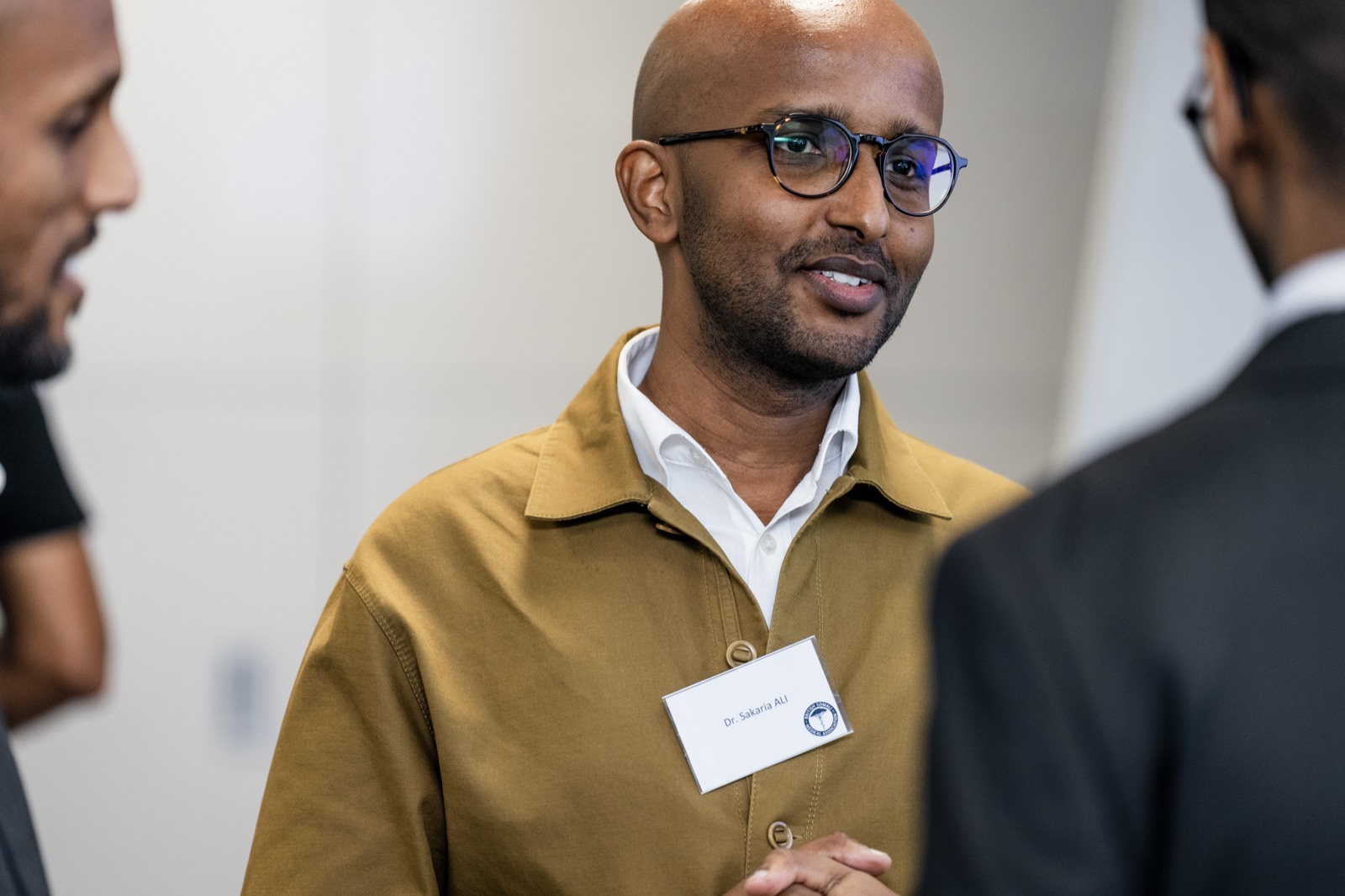 A member smiling in conversation at the National Conference 2024